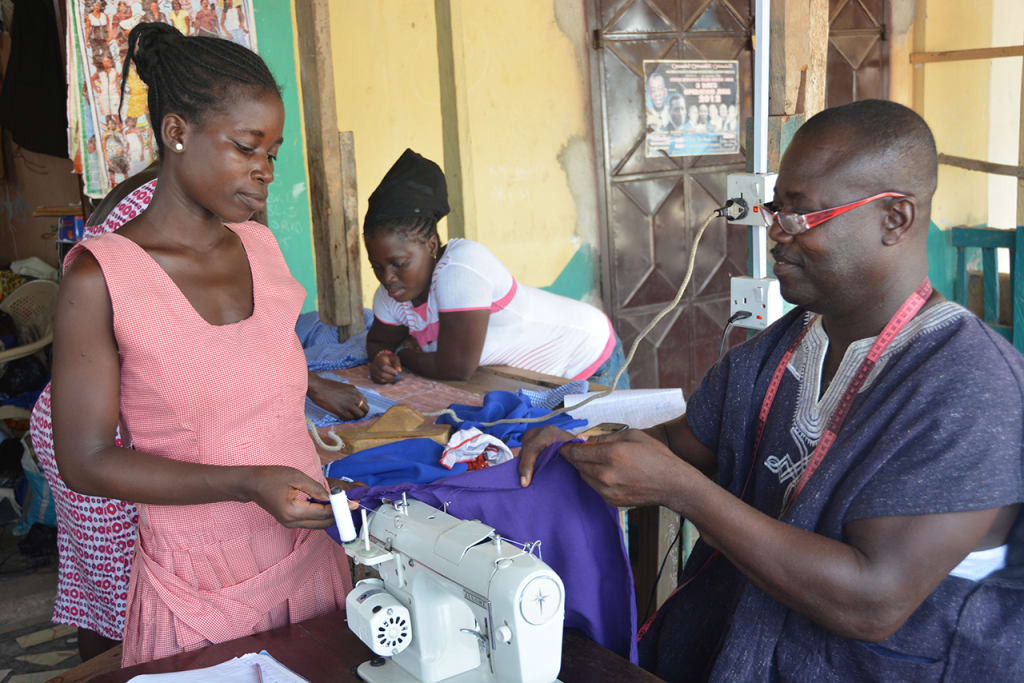 Lovintina learns sewing skills in her class at project